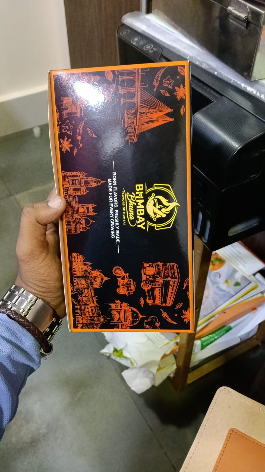 Customer photo of the black and orange Bombay Bhuna printed packaging box